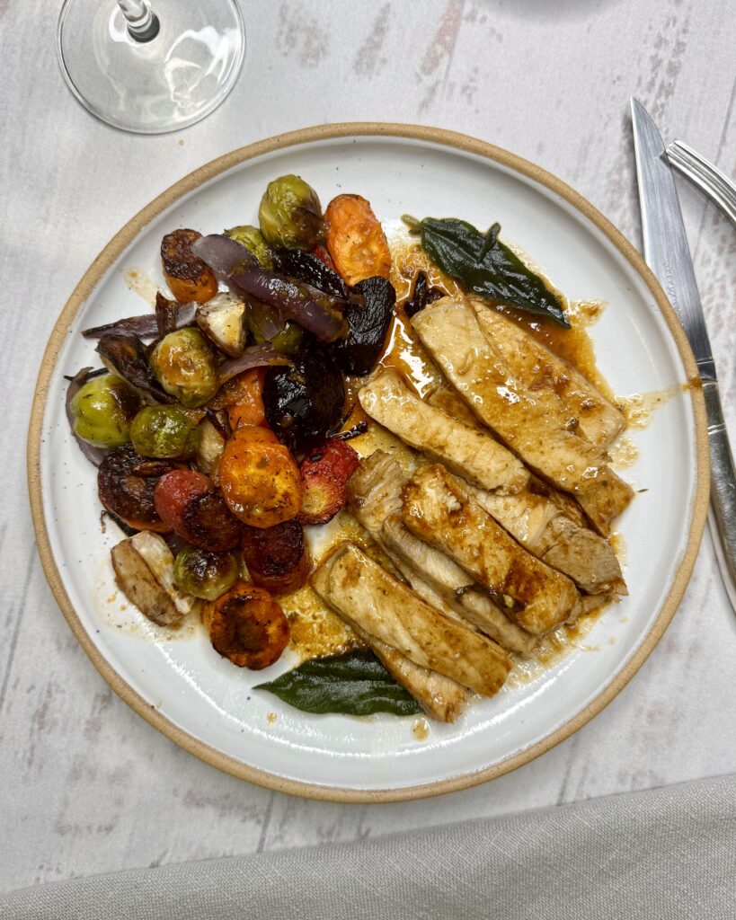 fried Pork Chops with brown gravy crispy sage leaves and roasted vegetables
