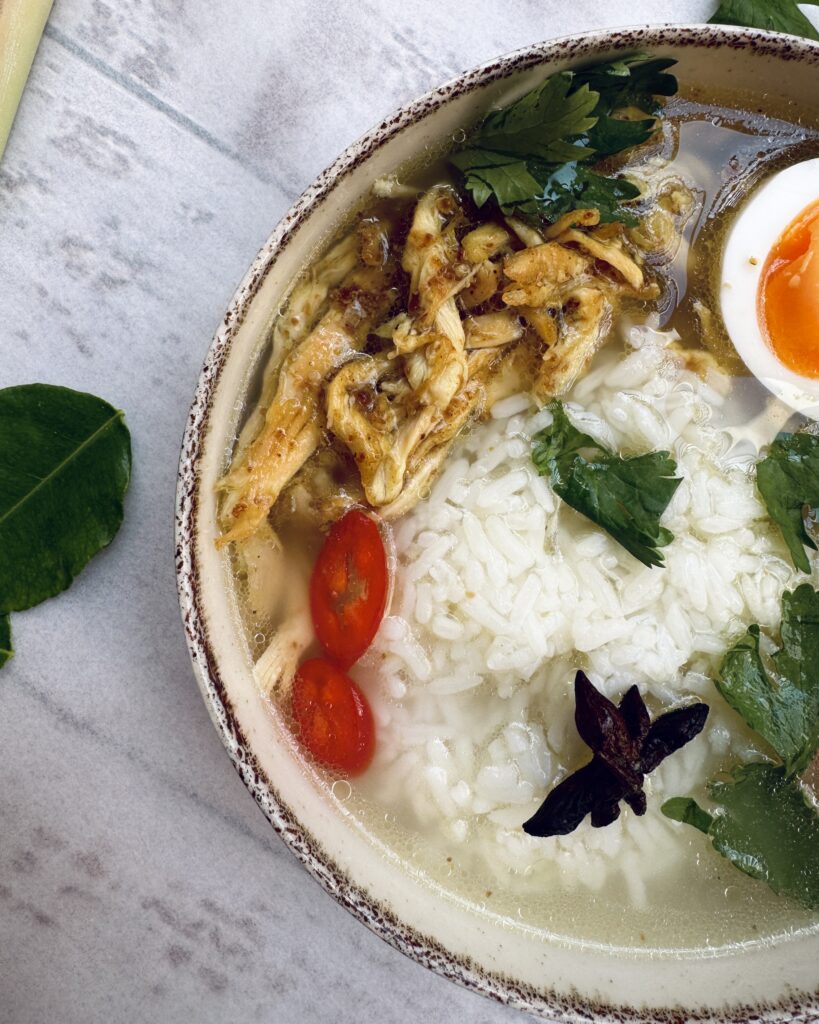 brothy rice with shredded chicken, eggs and cilantro and thai spices