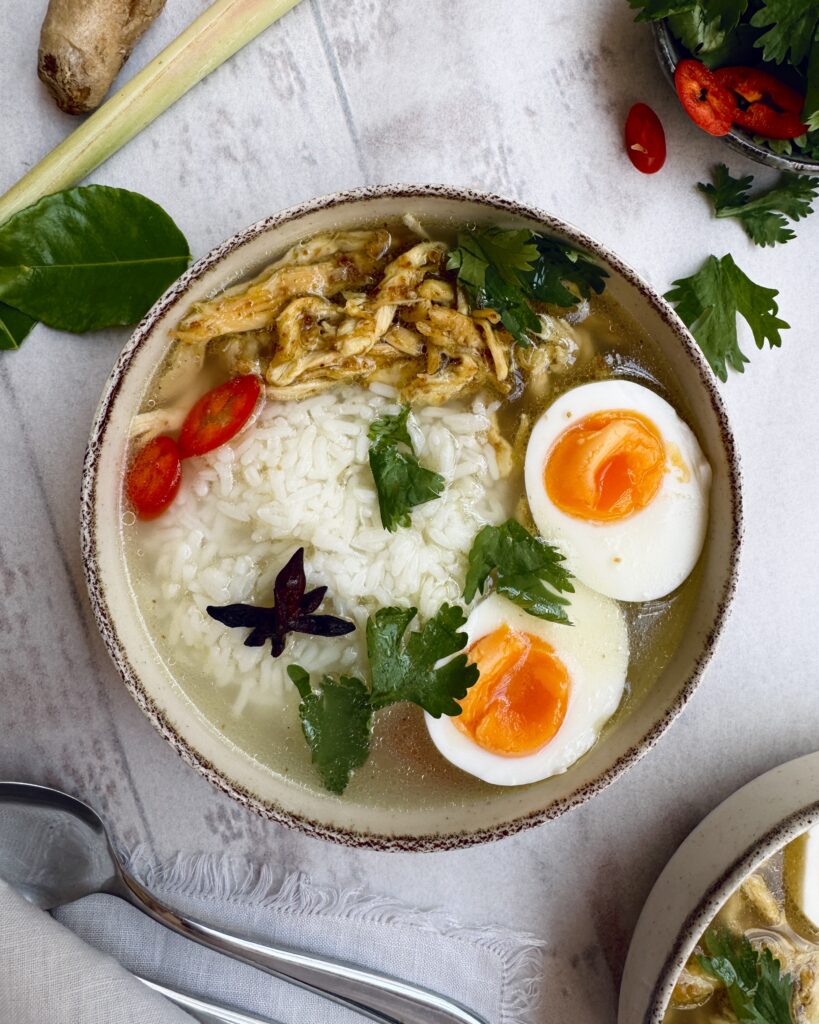 brothy rice with shredded chicken, eggs and cilantro and thai spices