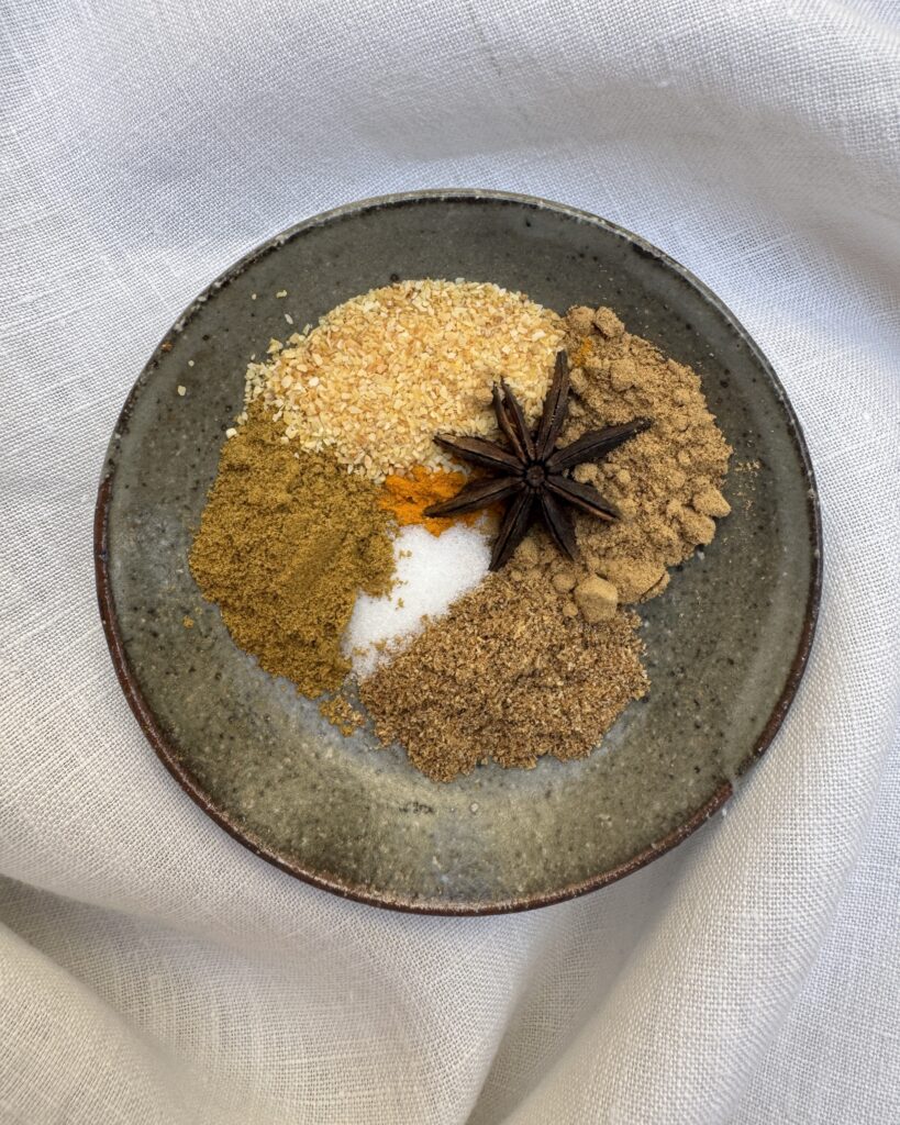 a small plate with ground spices