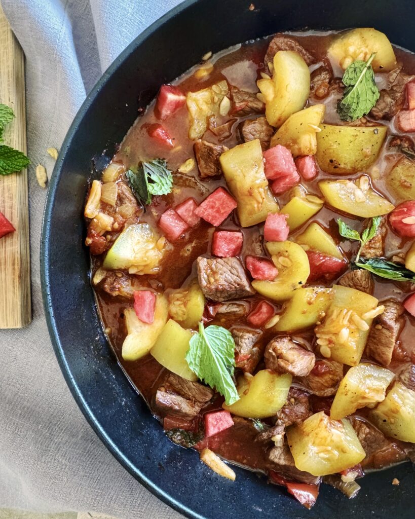 lamb stew with watermelon, tomatoes and green pumpkin