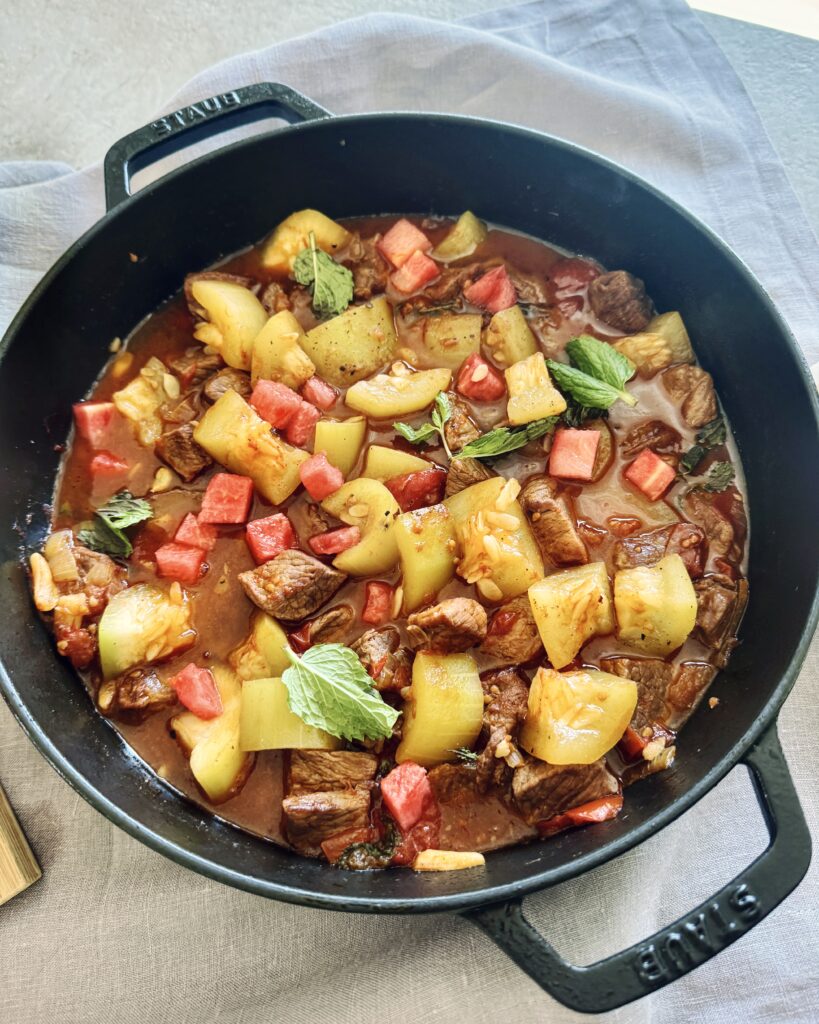lamb stew with watermelon, tomatoes and green pumpkin