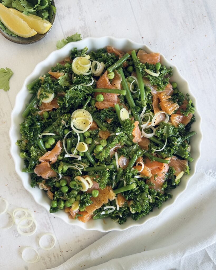 smoked salmon salad with orange and green vegetables